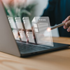 A businessman reviews the steps using a virtual online document